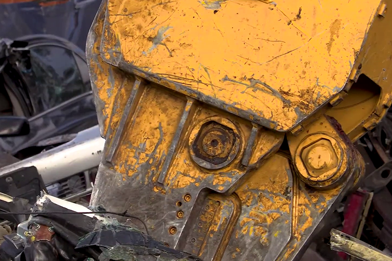 Close-up of the SK210D-11 Car Demolition Excavator's scrap arm