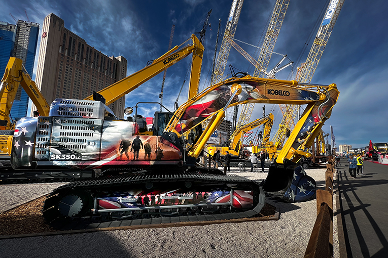 A large excavator wrapped in patriotic motifs